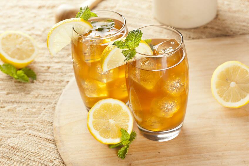 14876682 - refreshing iced tea with lemon against a background - Man ...